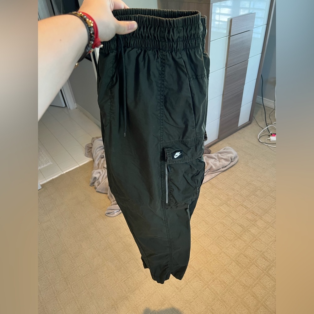 Nike cargo pants with pockets all around. Very nice and flattering pant!
